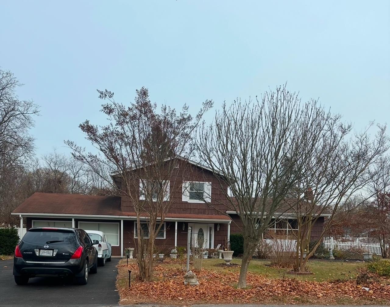 View of front of home featuring a garage