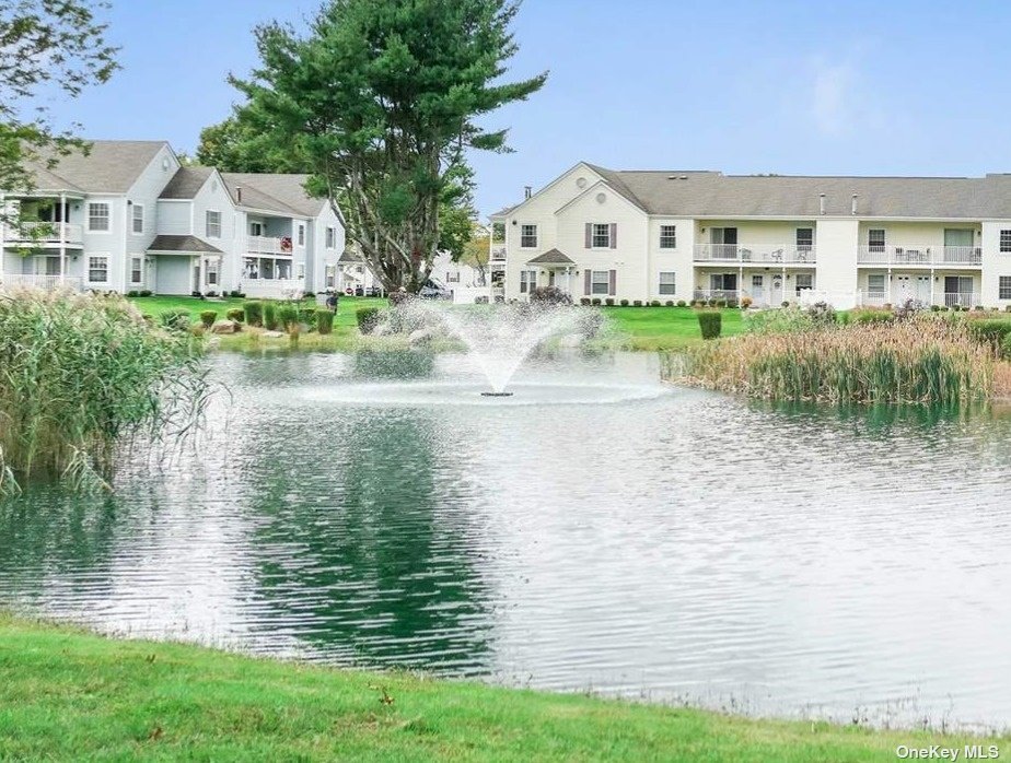 a view of a lake with a house in the background