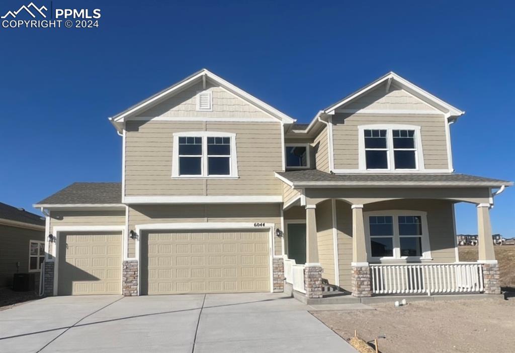 a front view of a house with a garage