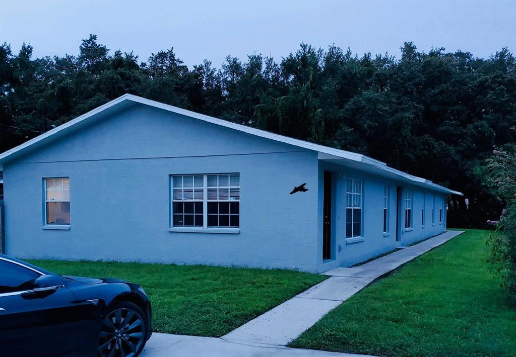 a view of a backyard of the house