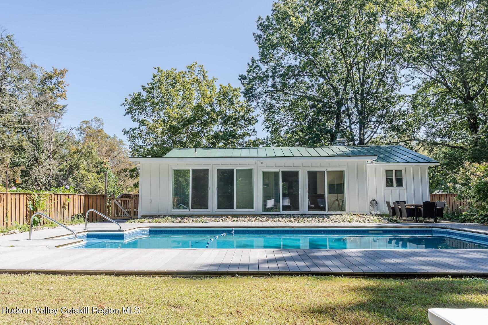 a house view with a swimming pool