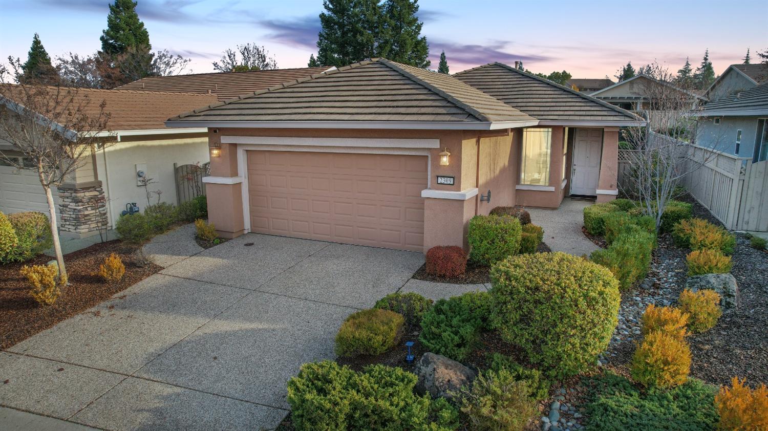 ADORED NEIGHBORHOOD LOCATION WITH WELCOMING EXTERIOR. 2 CAR GARAGE