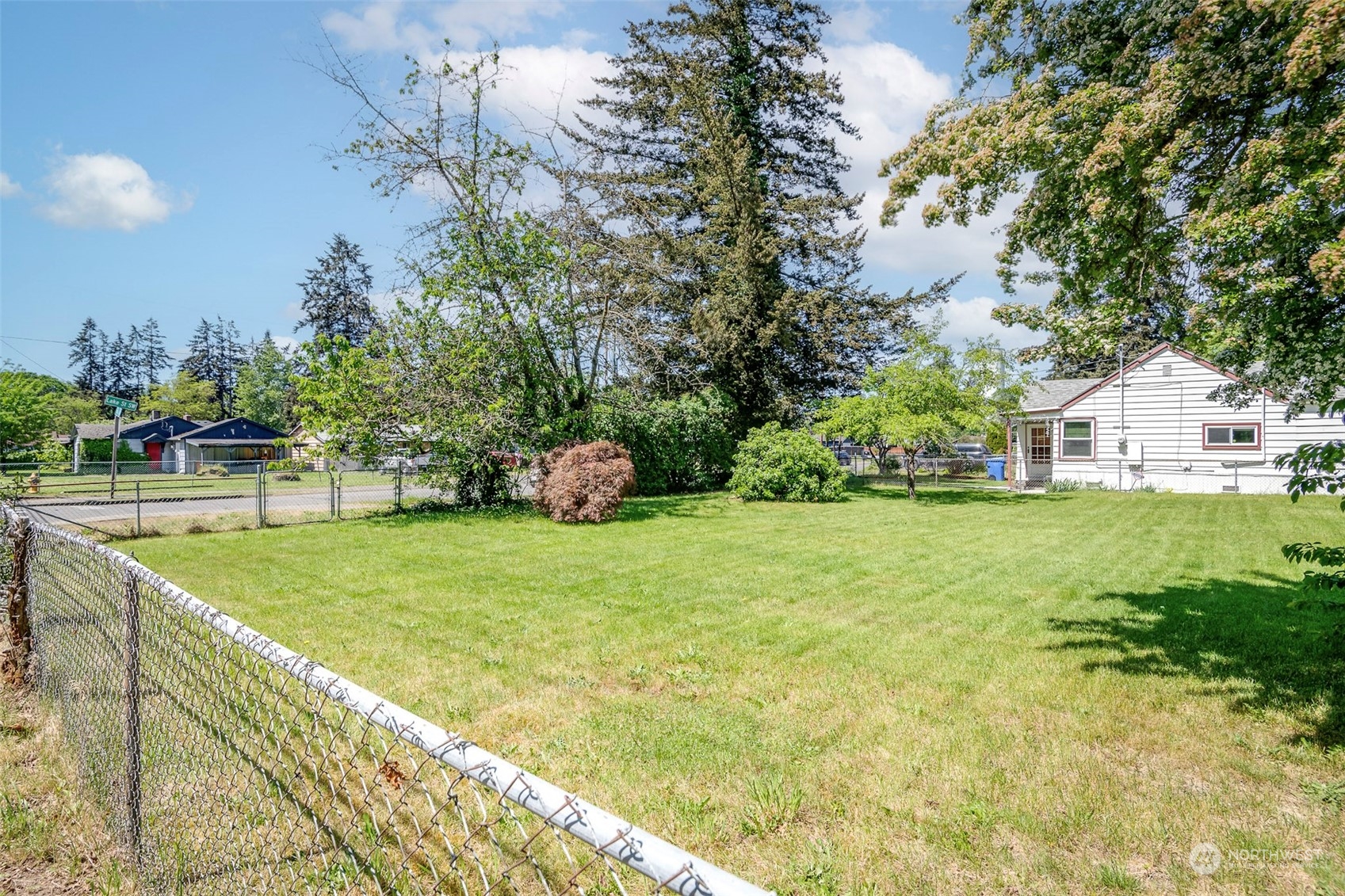 a view of green field with house in the background