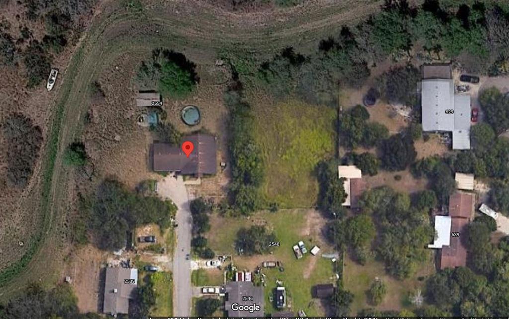 an aerial view of houses with outdoor space