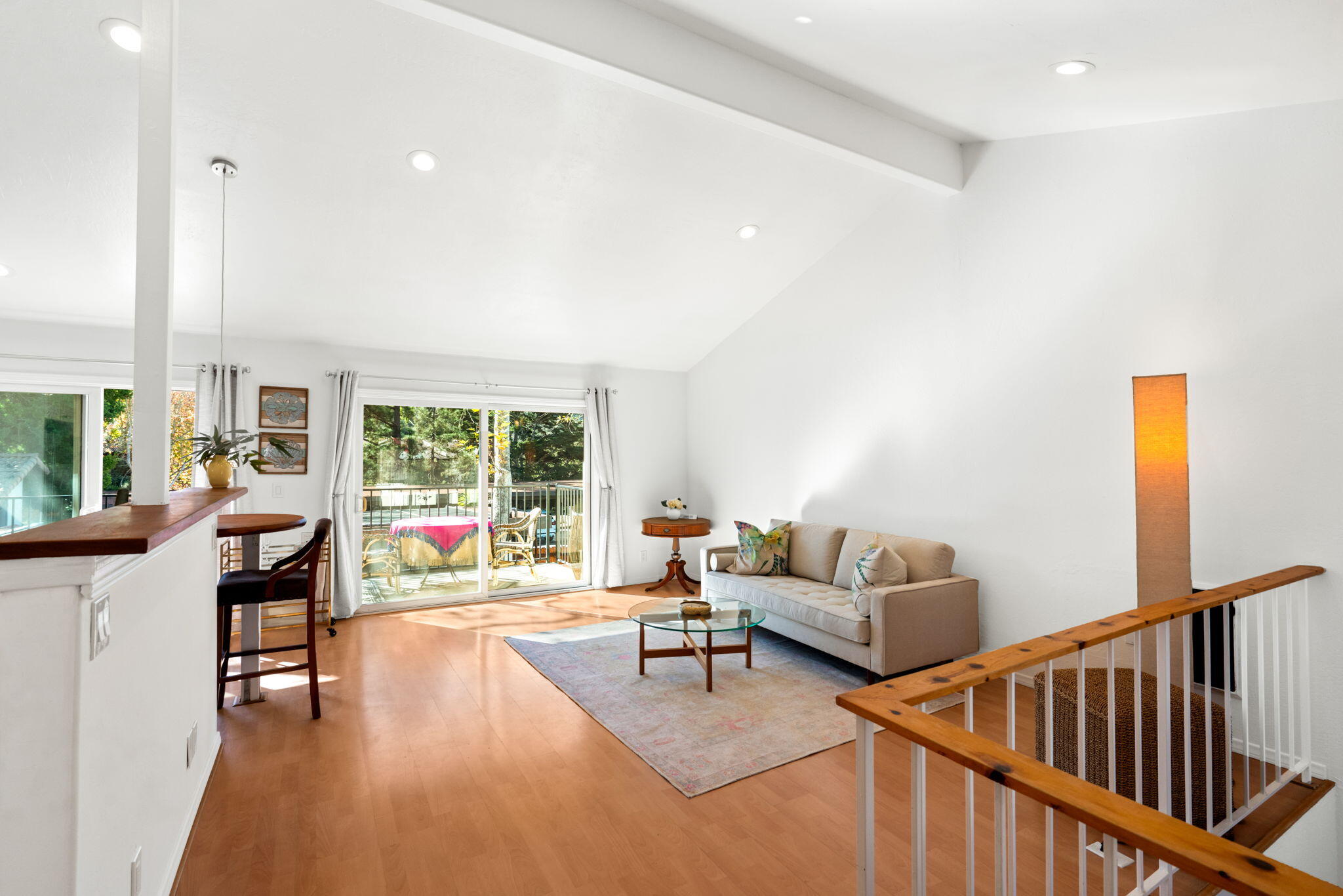 a living room with fireplace furniture and a large window