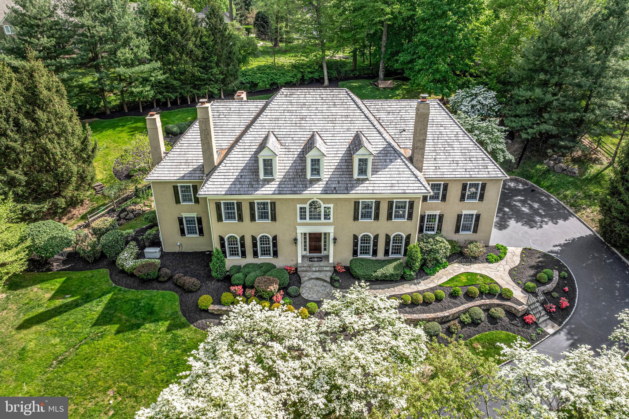 a aerial view of a house with a yard