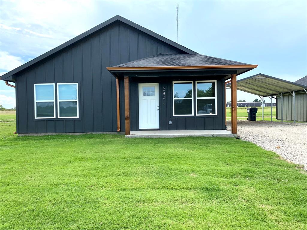 front view of a house with a yard