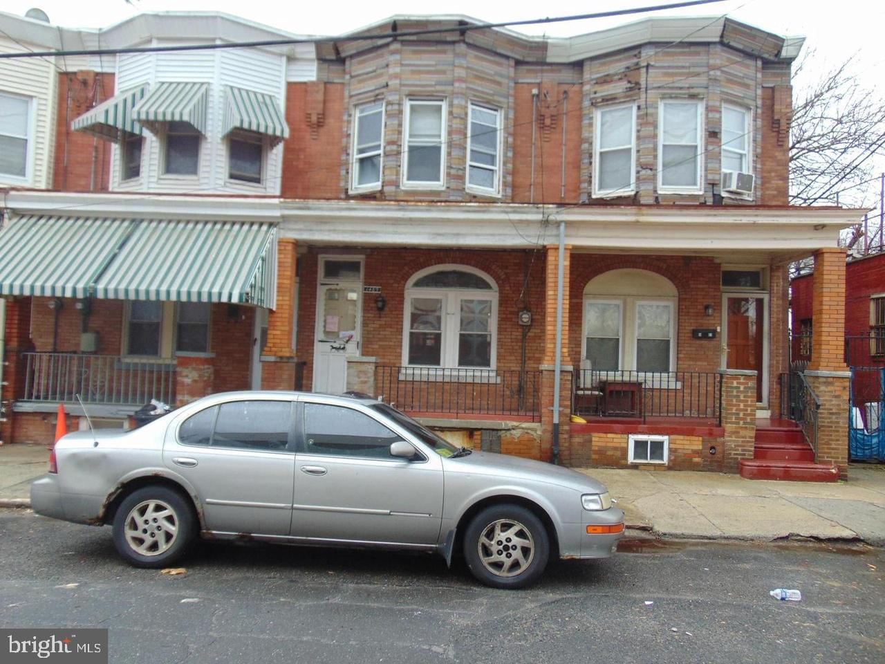 a front view of a house with parking space