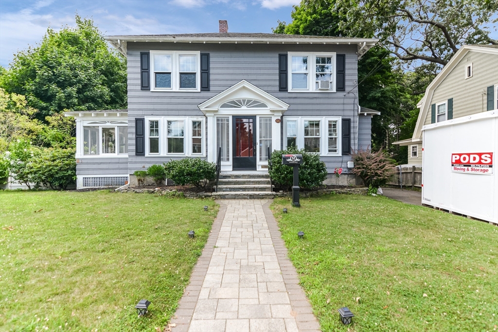 a front view of a house with garden