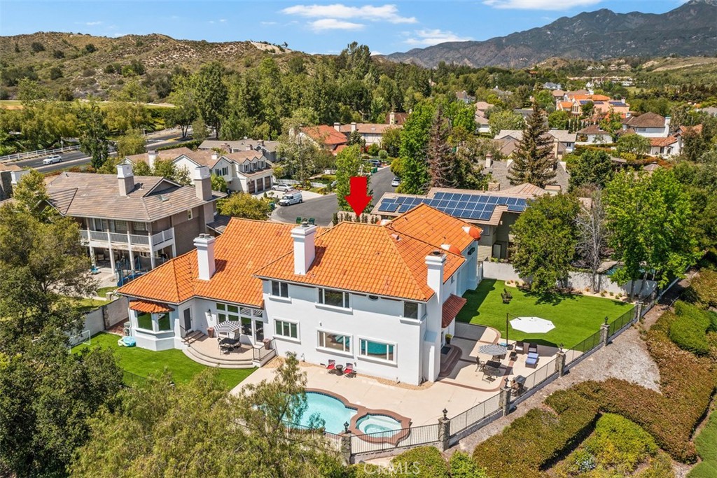 an aerial view of residential houses and outdoor space