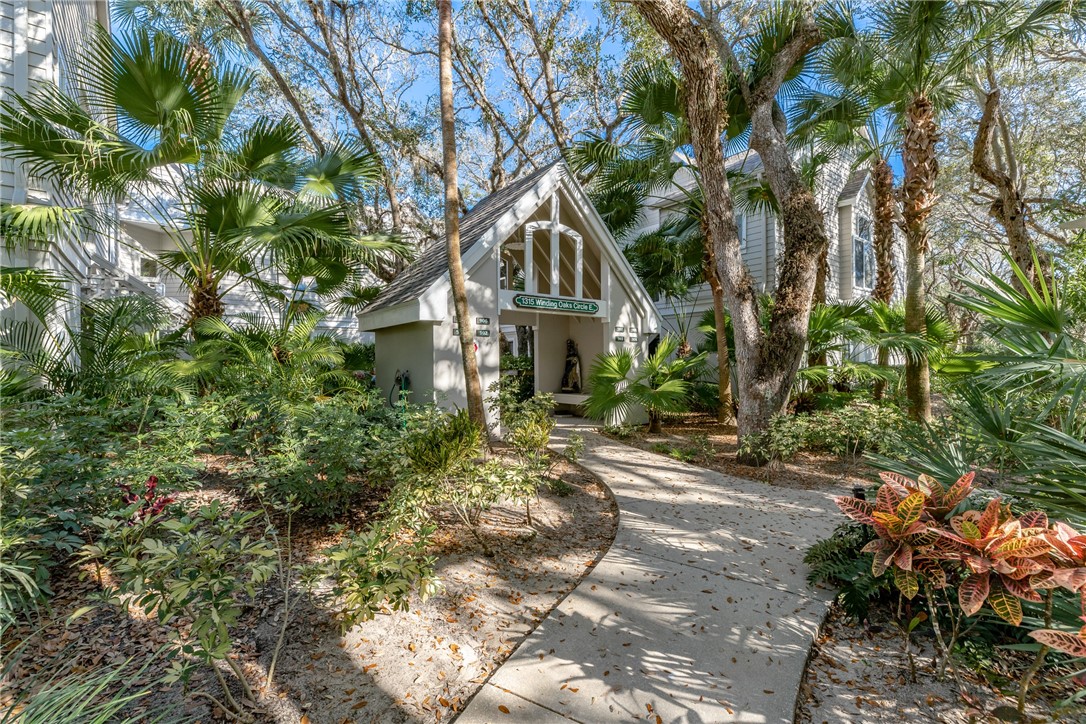 a house with a tree in front of it