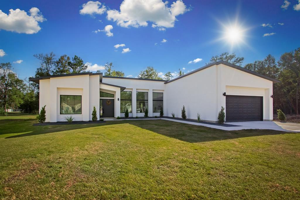 a view of a house with swimming pool and sitting area