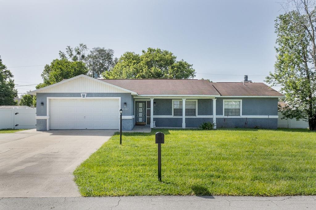 a front view of a house with a yard