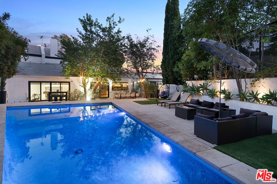 a view of a patio with swimming pool