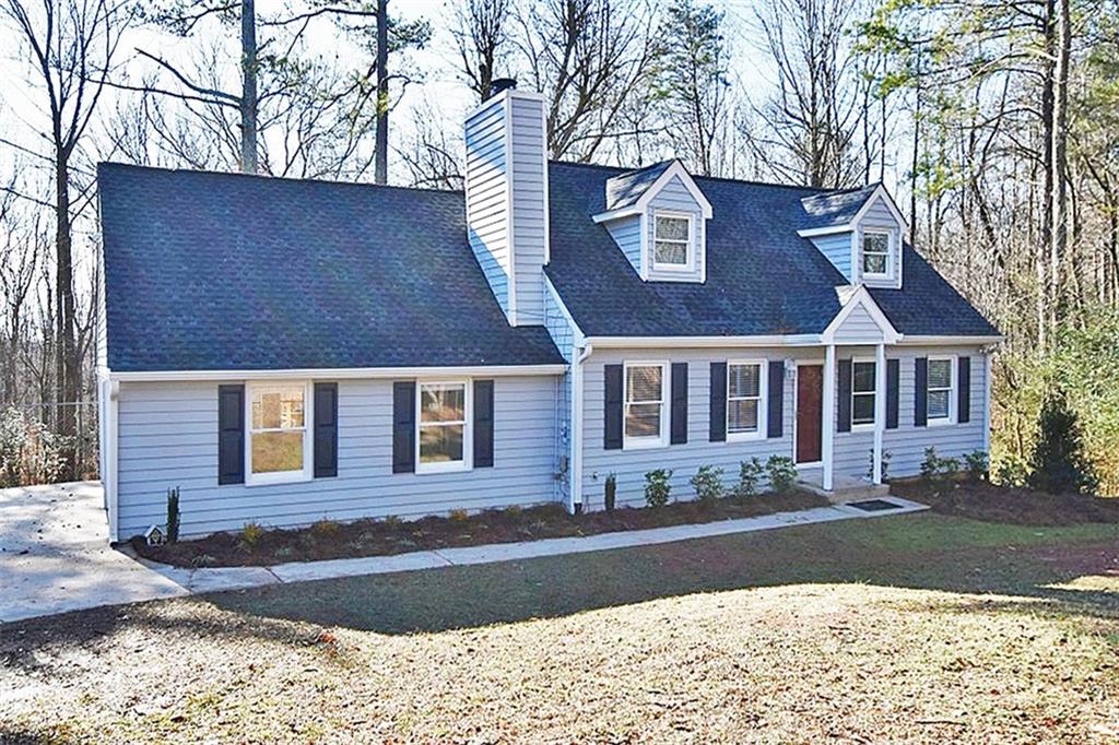 a front view of residential houses with yard