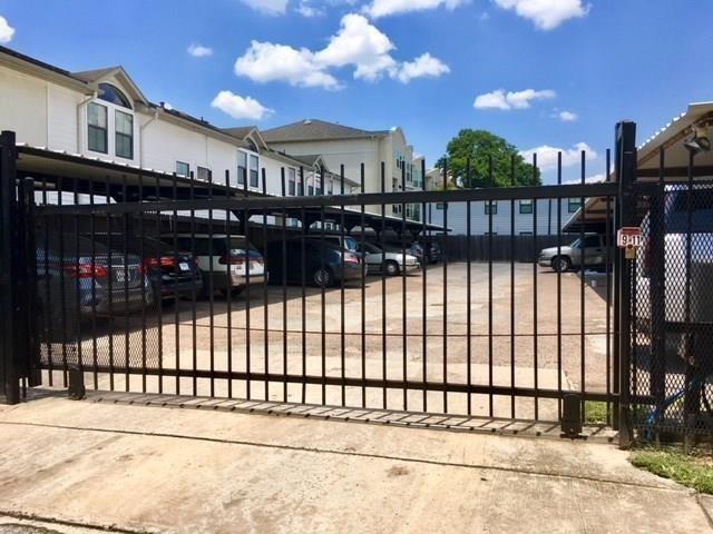 Gated parking lot with 2 primo covered parking spaces