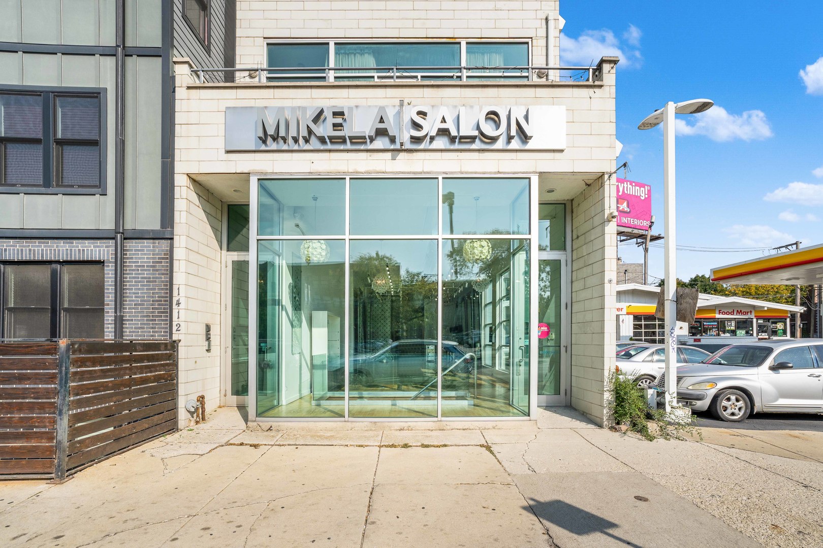 a front view of a building with parking