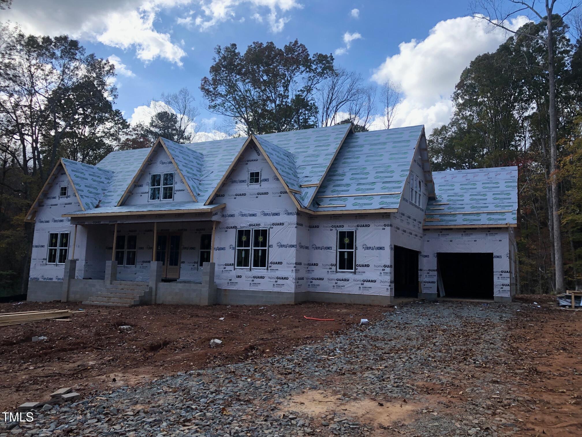 a front view of a house with yard