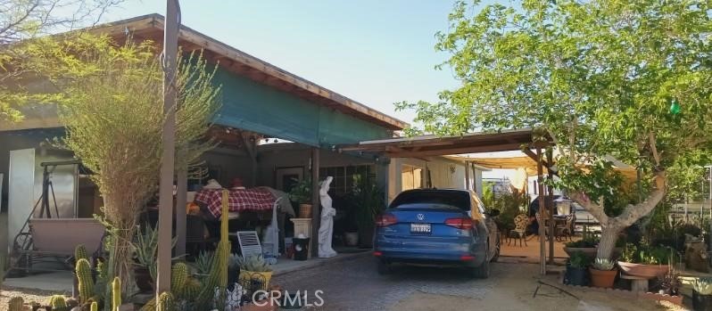 a view of a car park in front of house