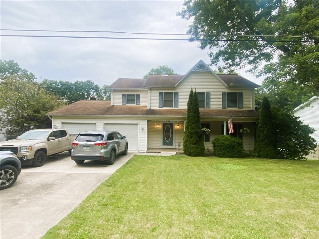 a view of house with yard and entertaining space