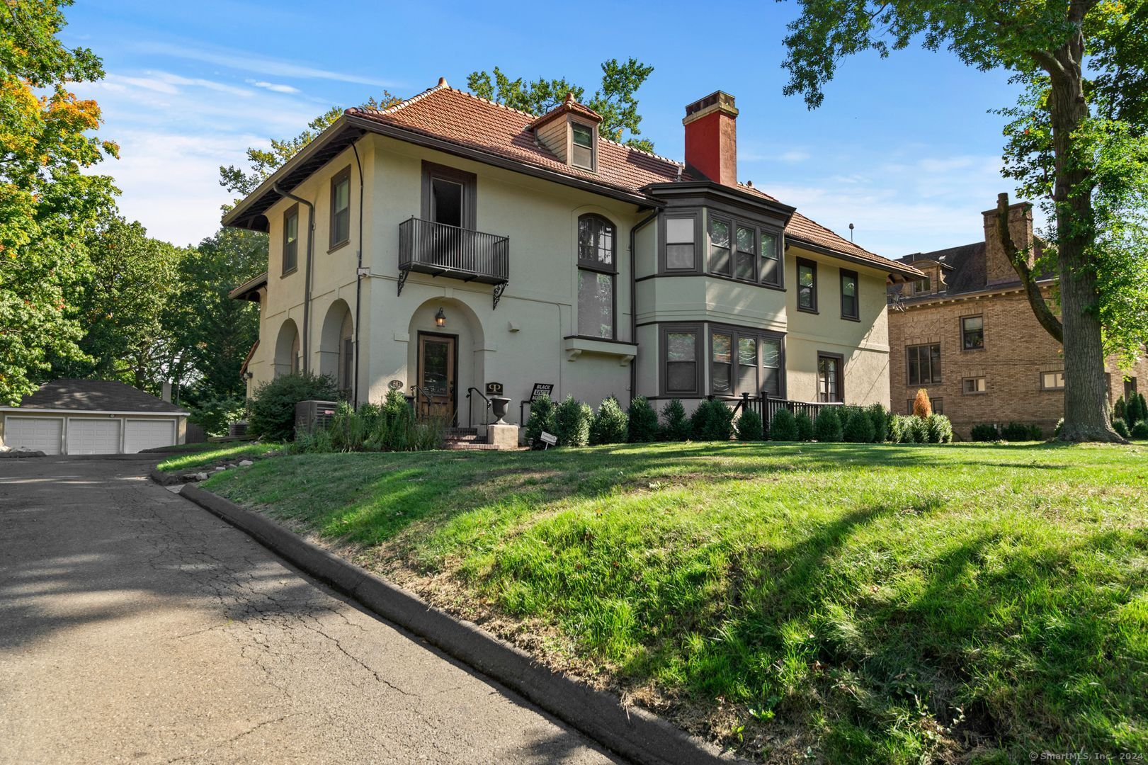 a front view of a house with garden