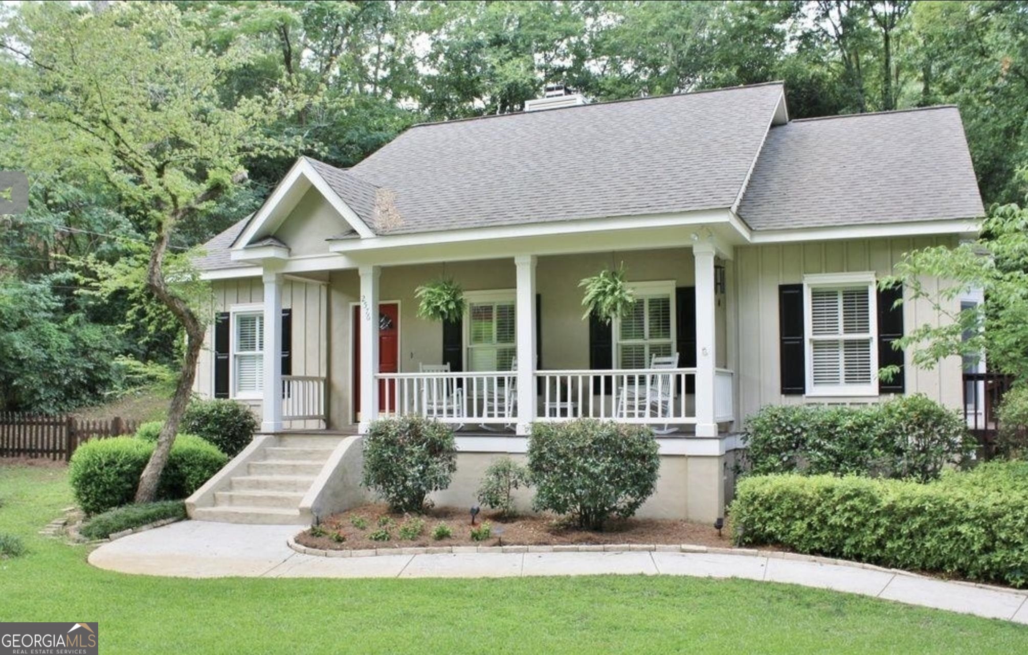 a view of a house with a yard and plants