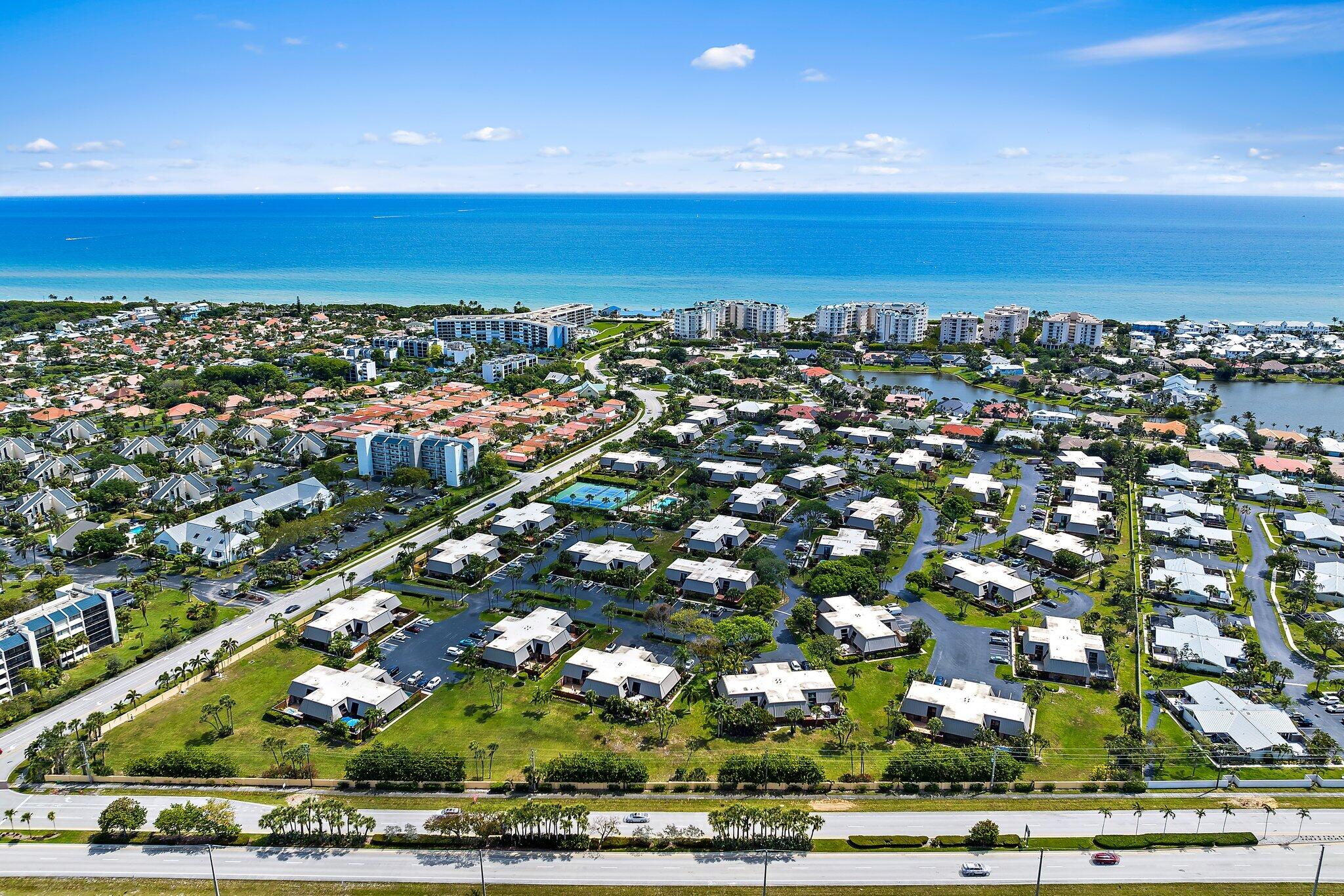 an aerial view of residential houses with outdoor space