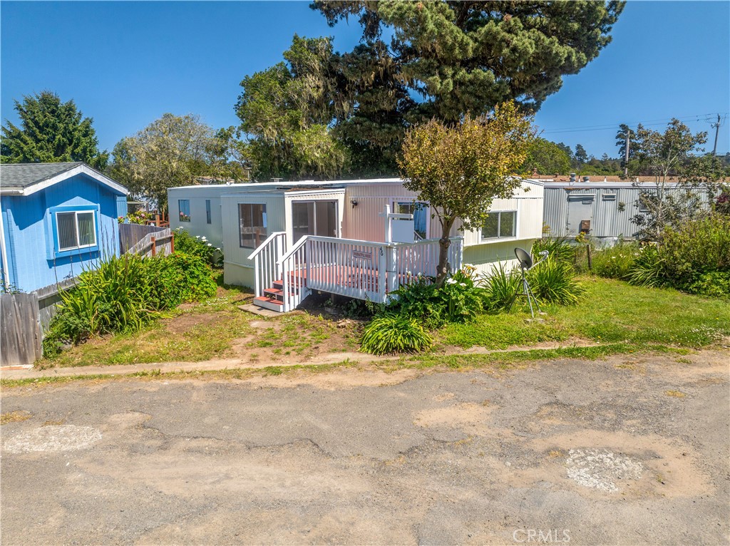 a front view of a house with a yard and a garage