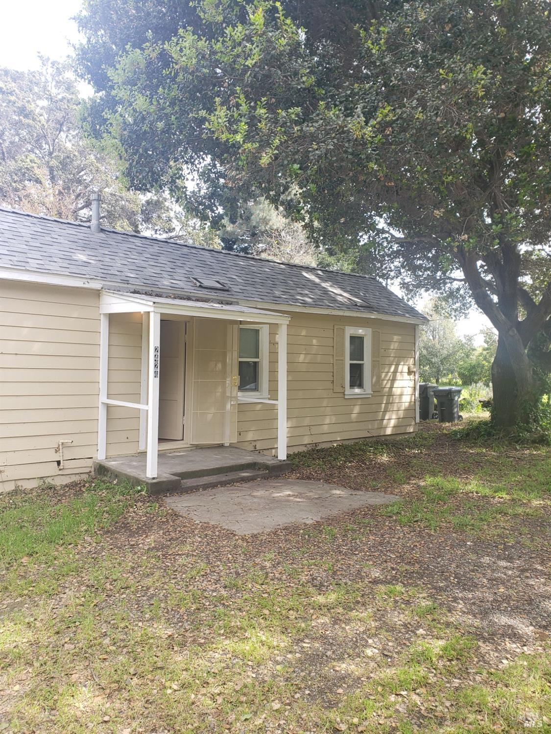 a view of a house with a yard