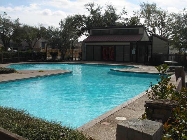 a view of a house with a yard patio and a garden