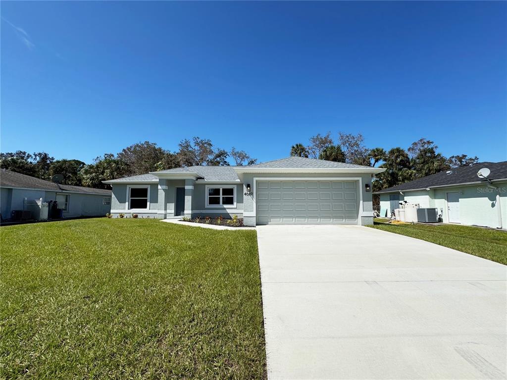 a front view of house with yard and seating area