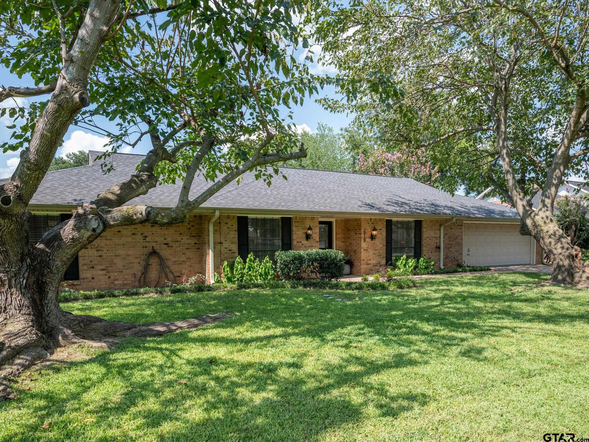 a front view of a house with yard