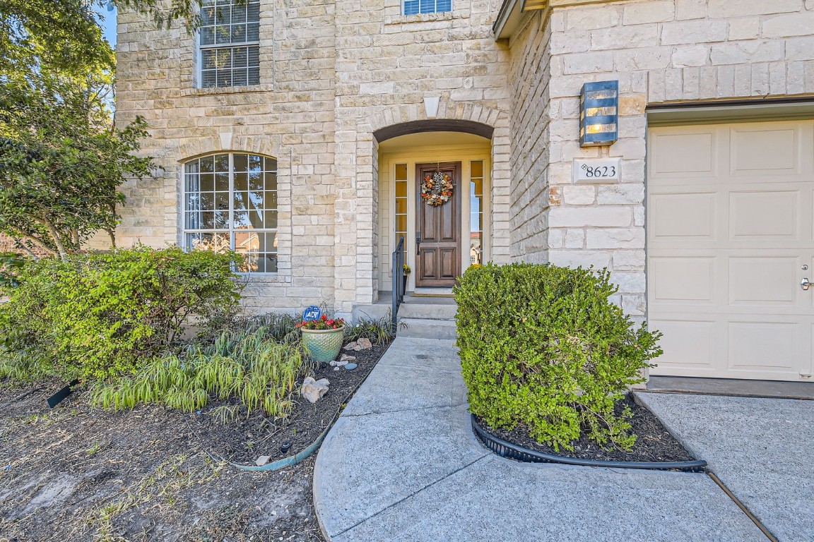 a front view of a house with garden