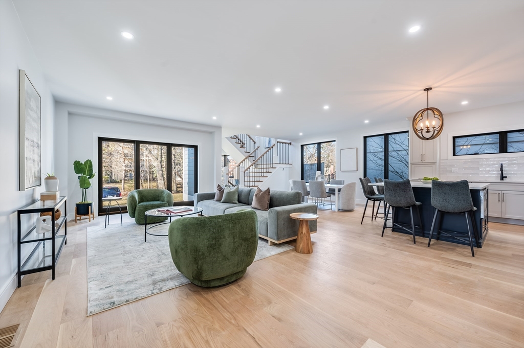 a living room with lots of furniture and window