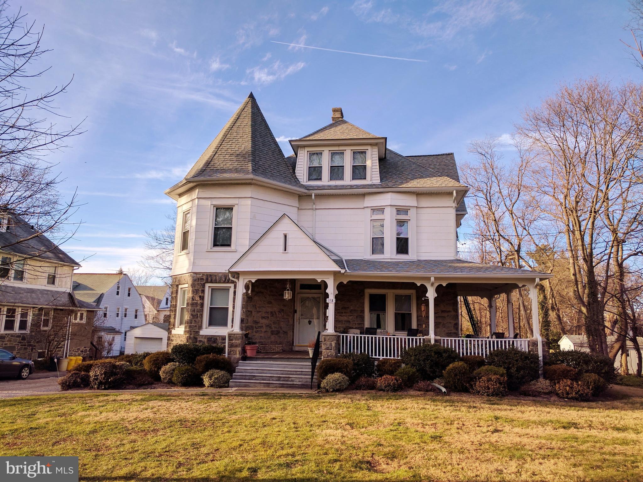 a front view of a houses with yard