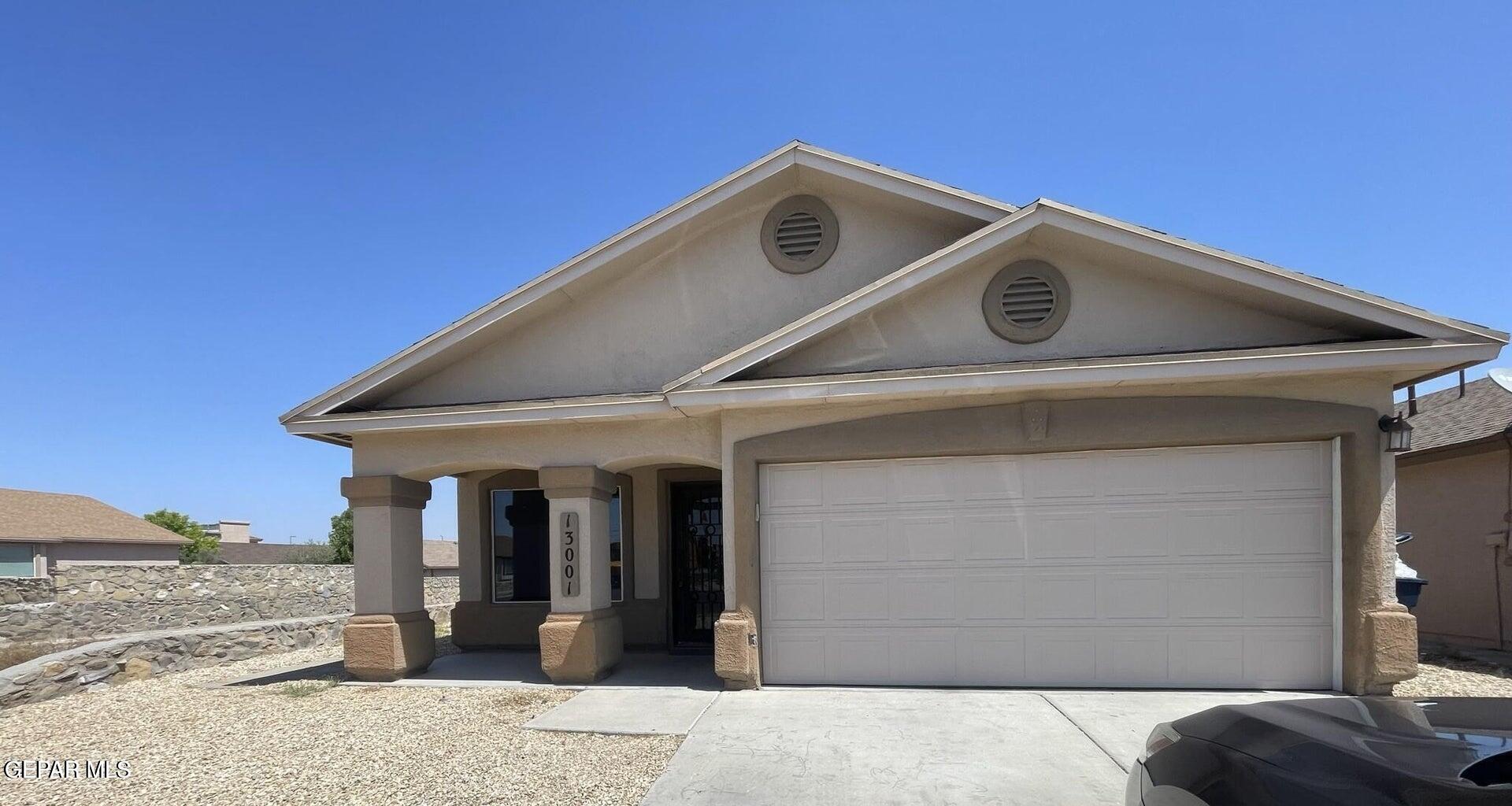 a front view of a house with parking