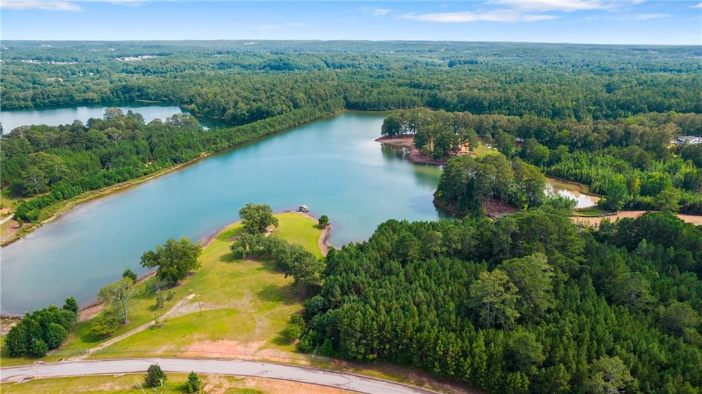 aerial view of a house with a lake view