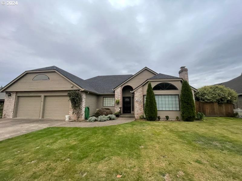 a front view of a house with yard outdoor seating and yard