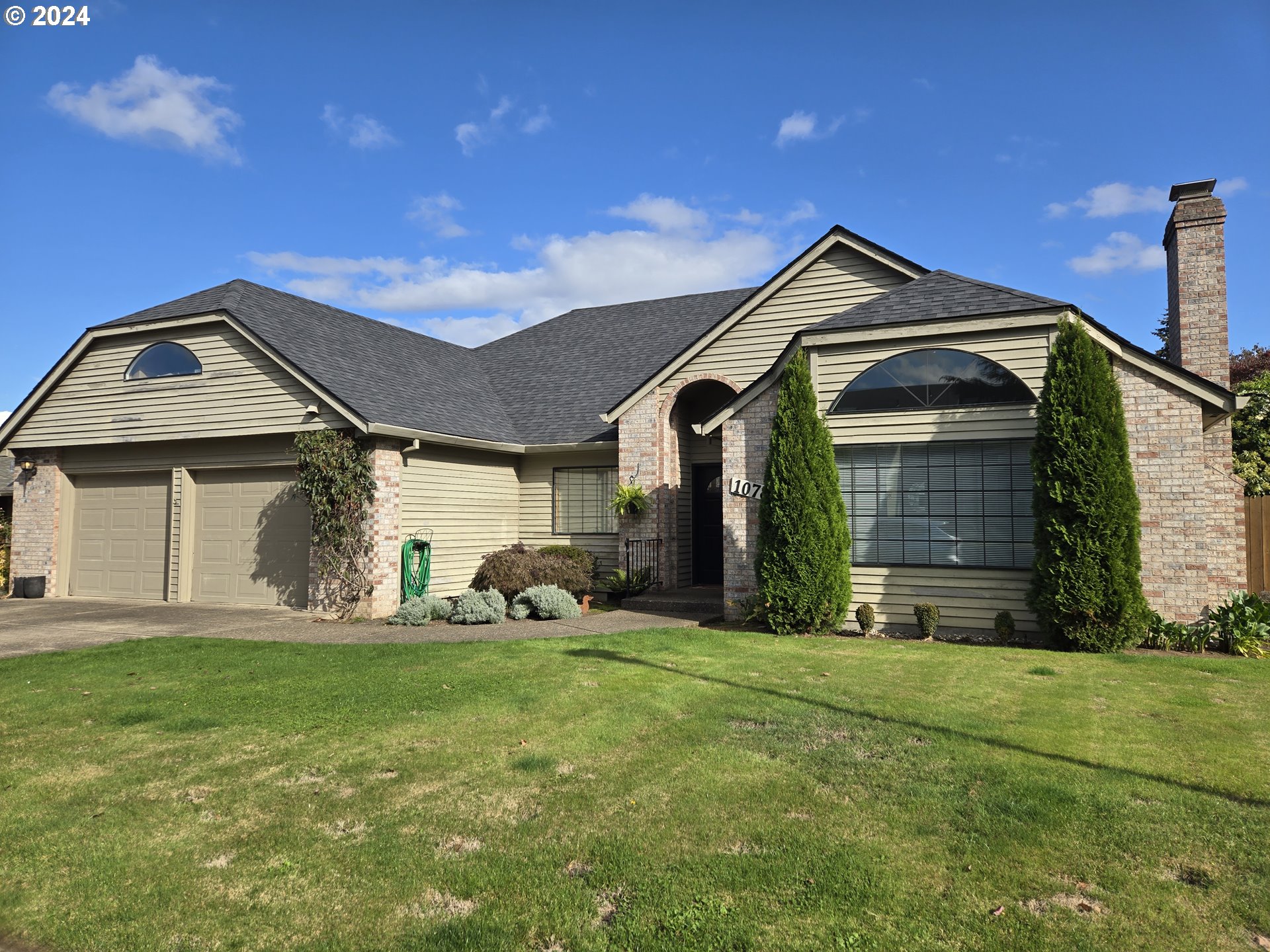 a front view of a house with a yard