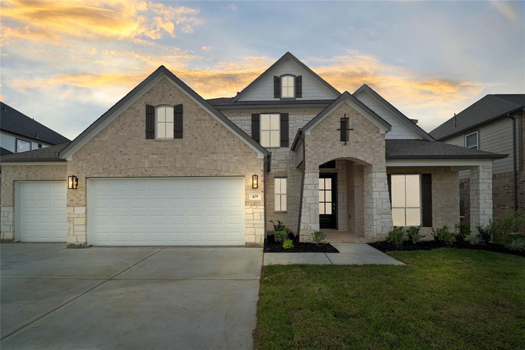 front view of a house with a yard