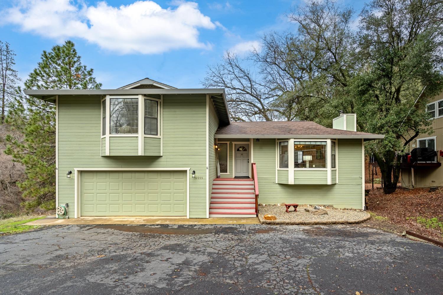 a front view of a house with a garage