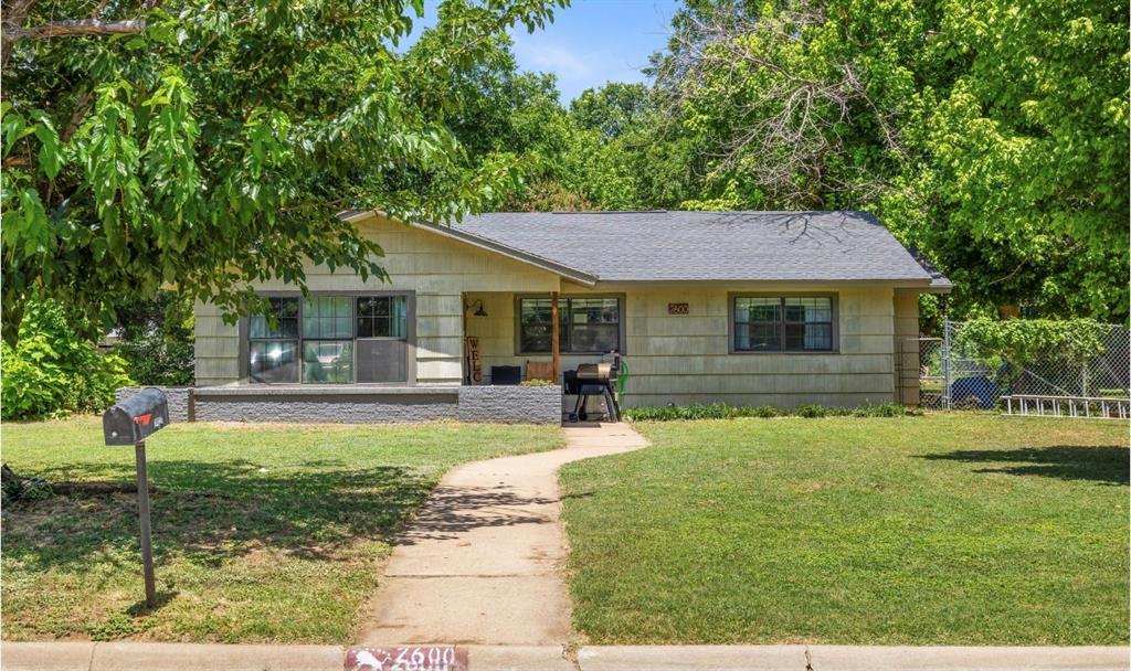 a view of a house with a yard porch and sitting area