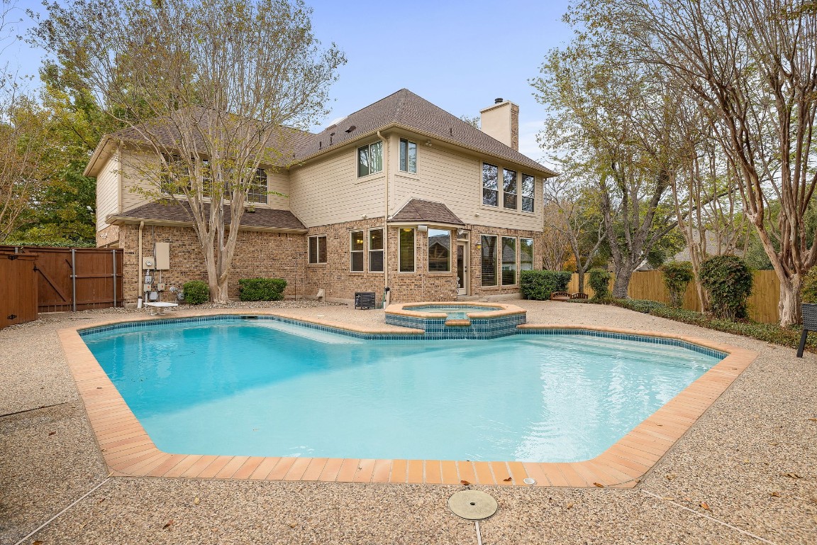 a front view of a house with swimming pool