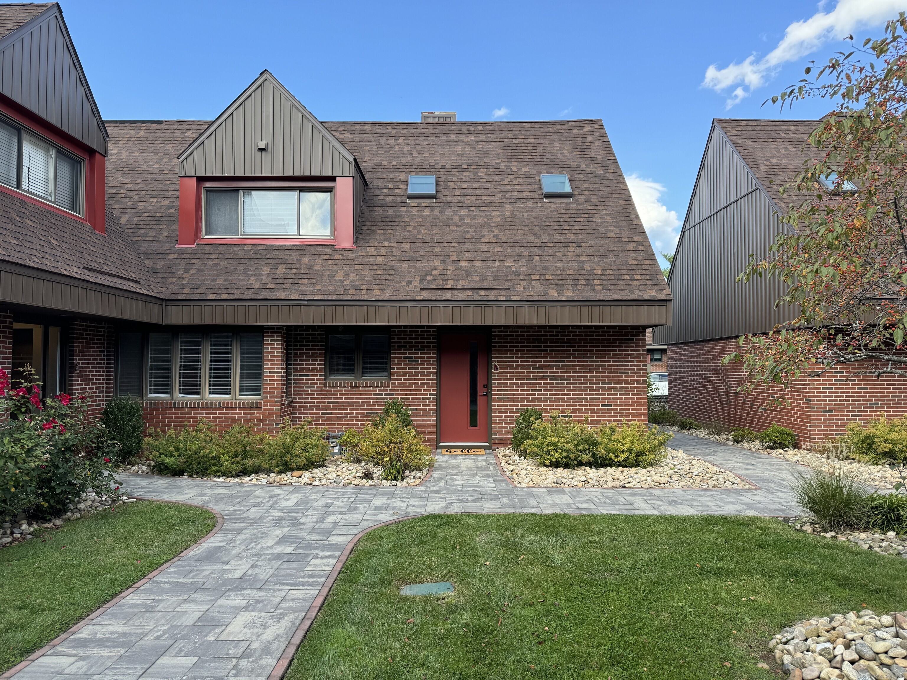 a aerial view of house with yard and outdoor seating