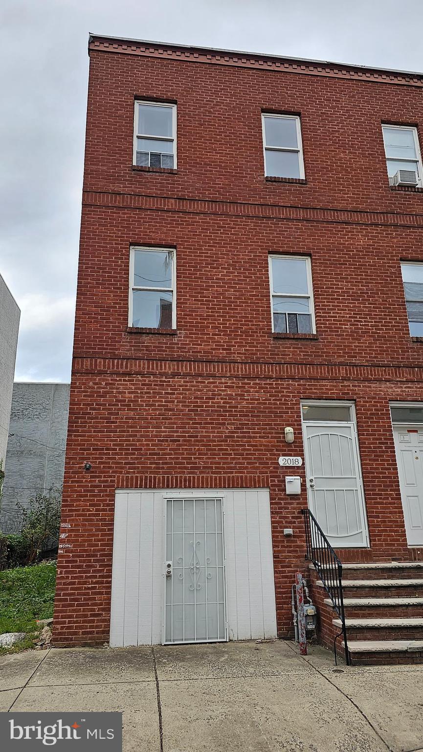 a building view with a brick wall