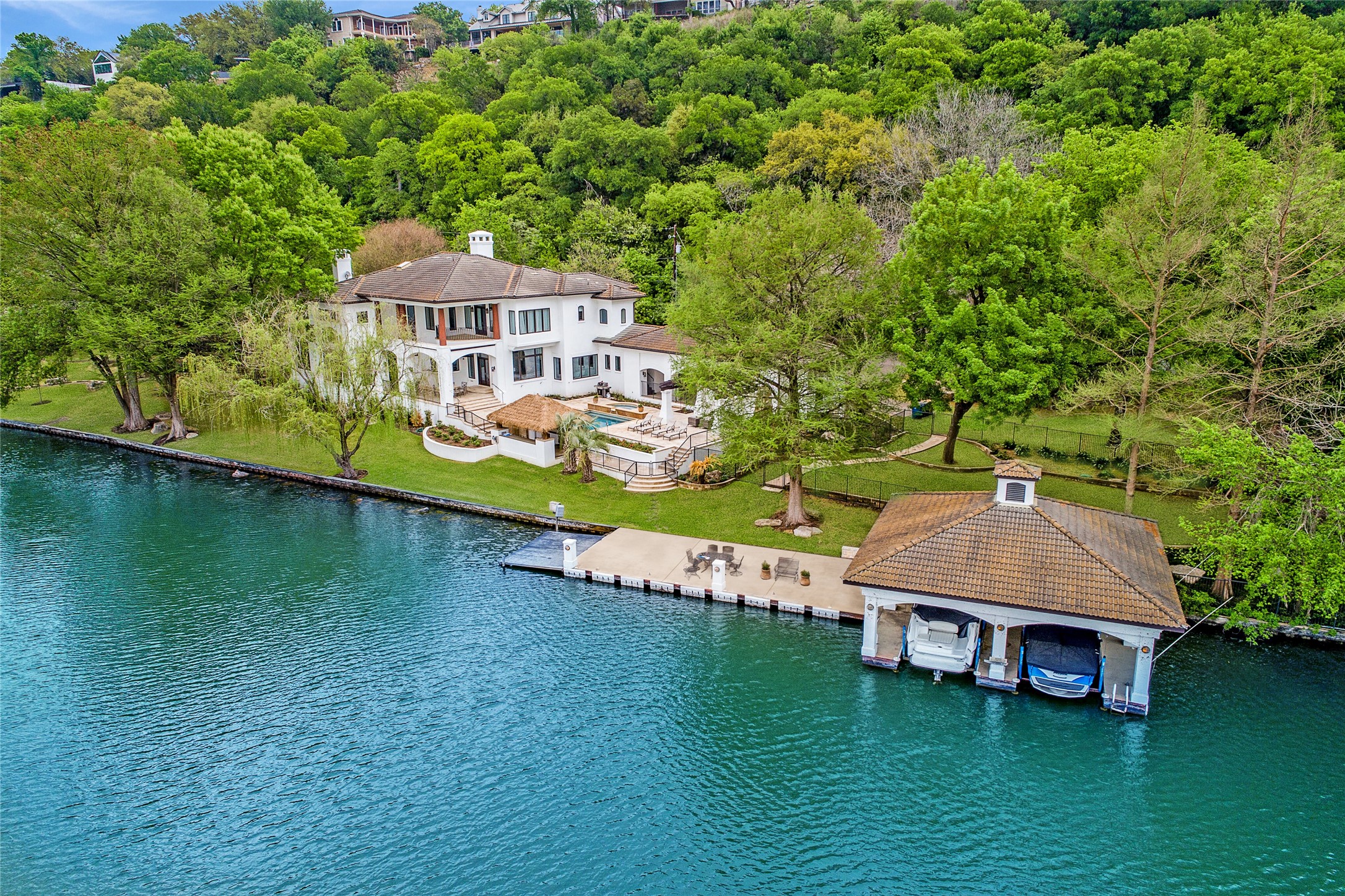 an aerial view of a house with swimming pool garden view