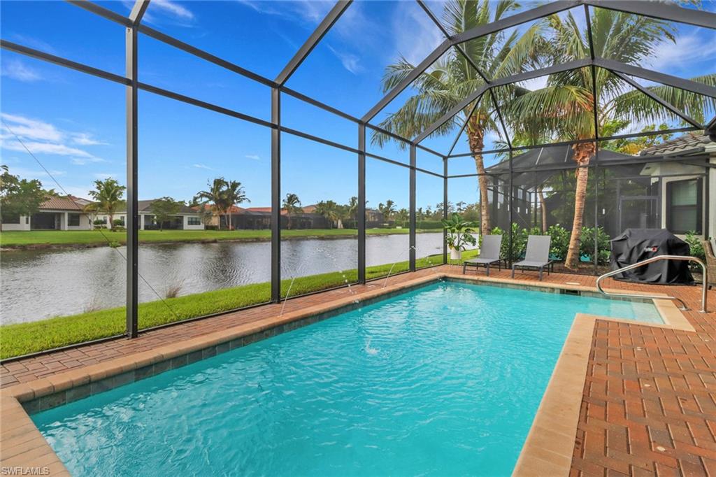 a view of swimming pool with a yard and a porch