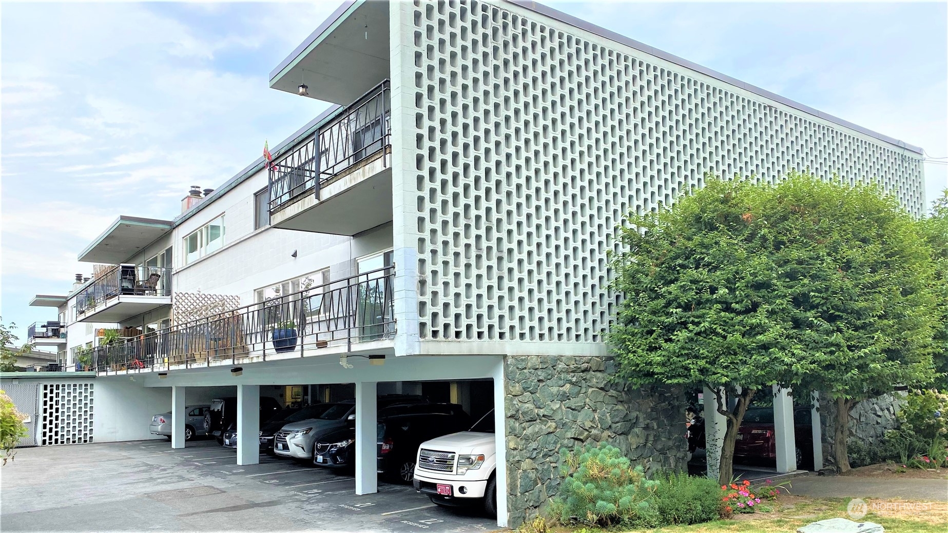 a front view of a building with parking space