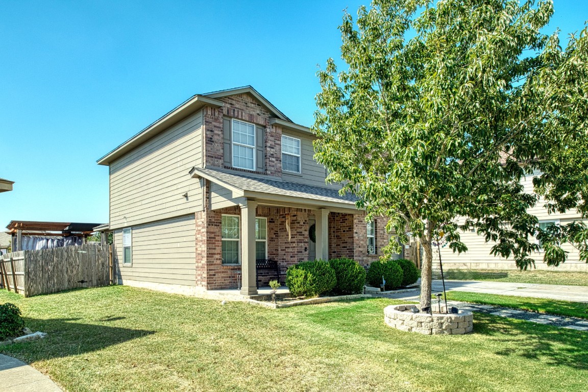 a front view of a house with a yard