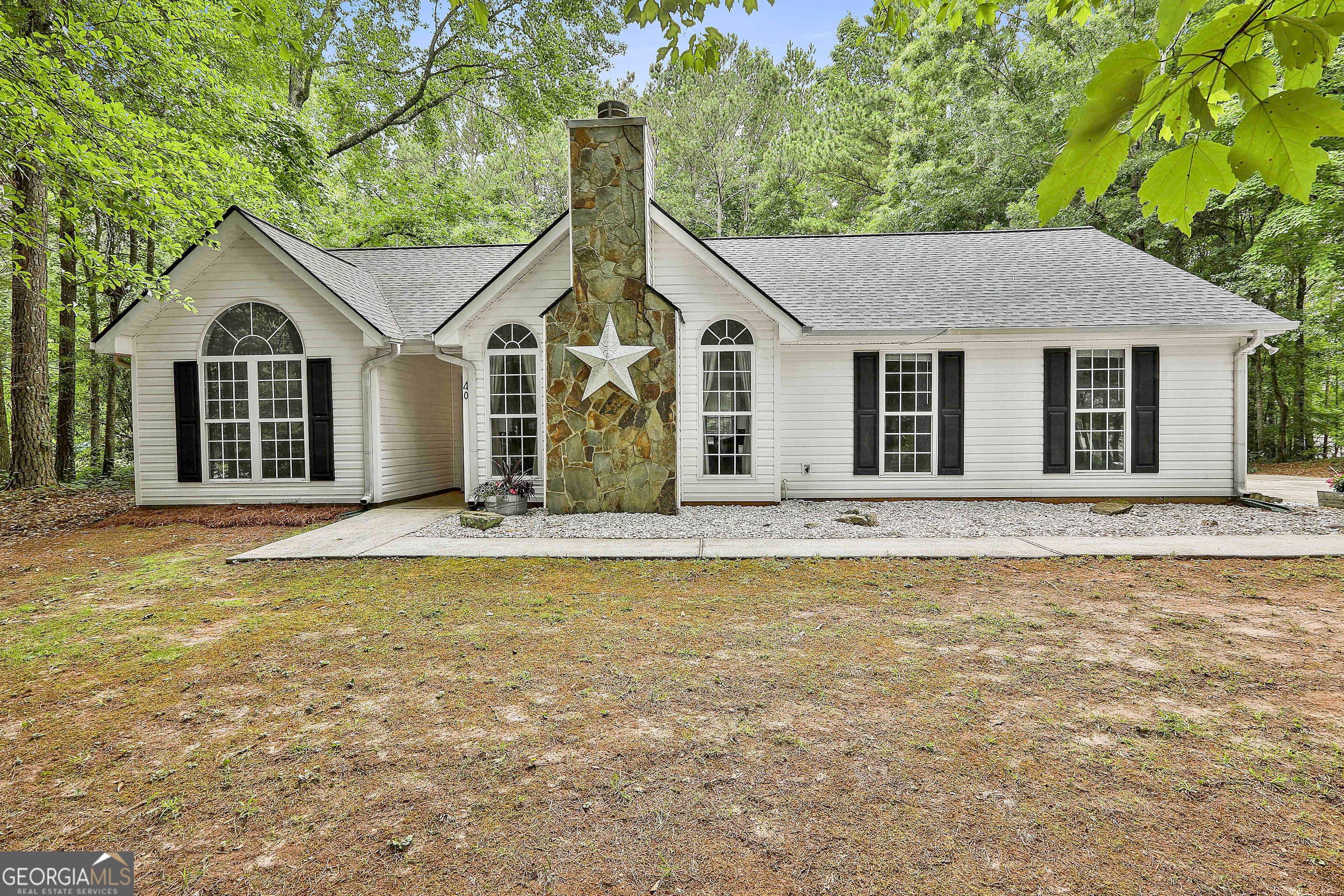 a front view of a house with yard